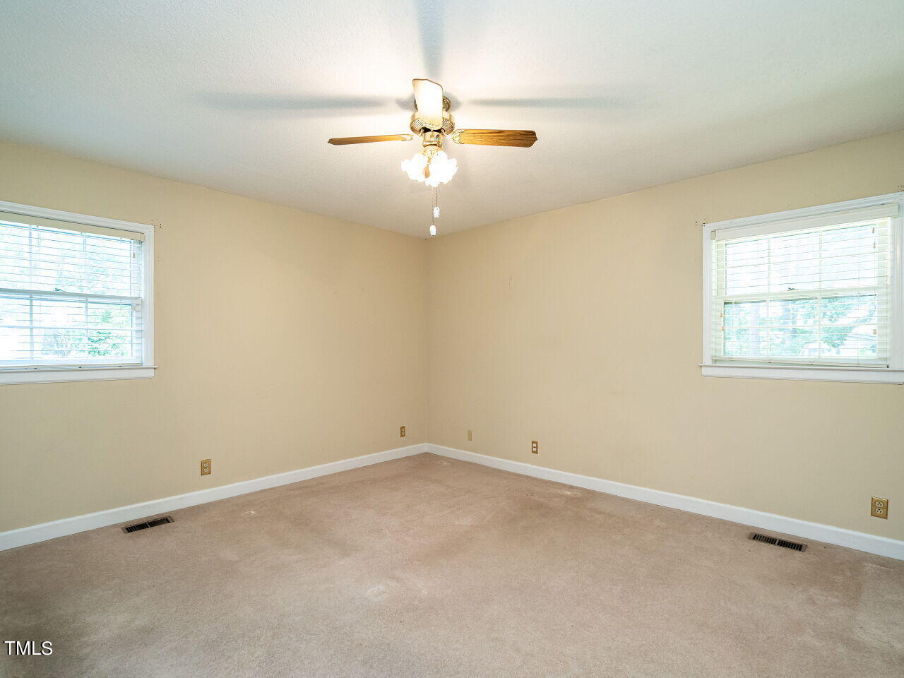6600 Barbee Road Durham, NC 27713 - Photo 22 of 33 an empty room with a window and ceiling fan