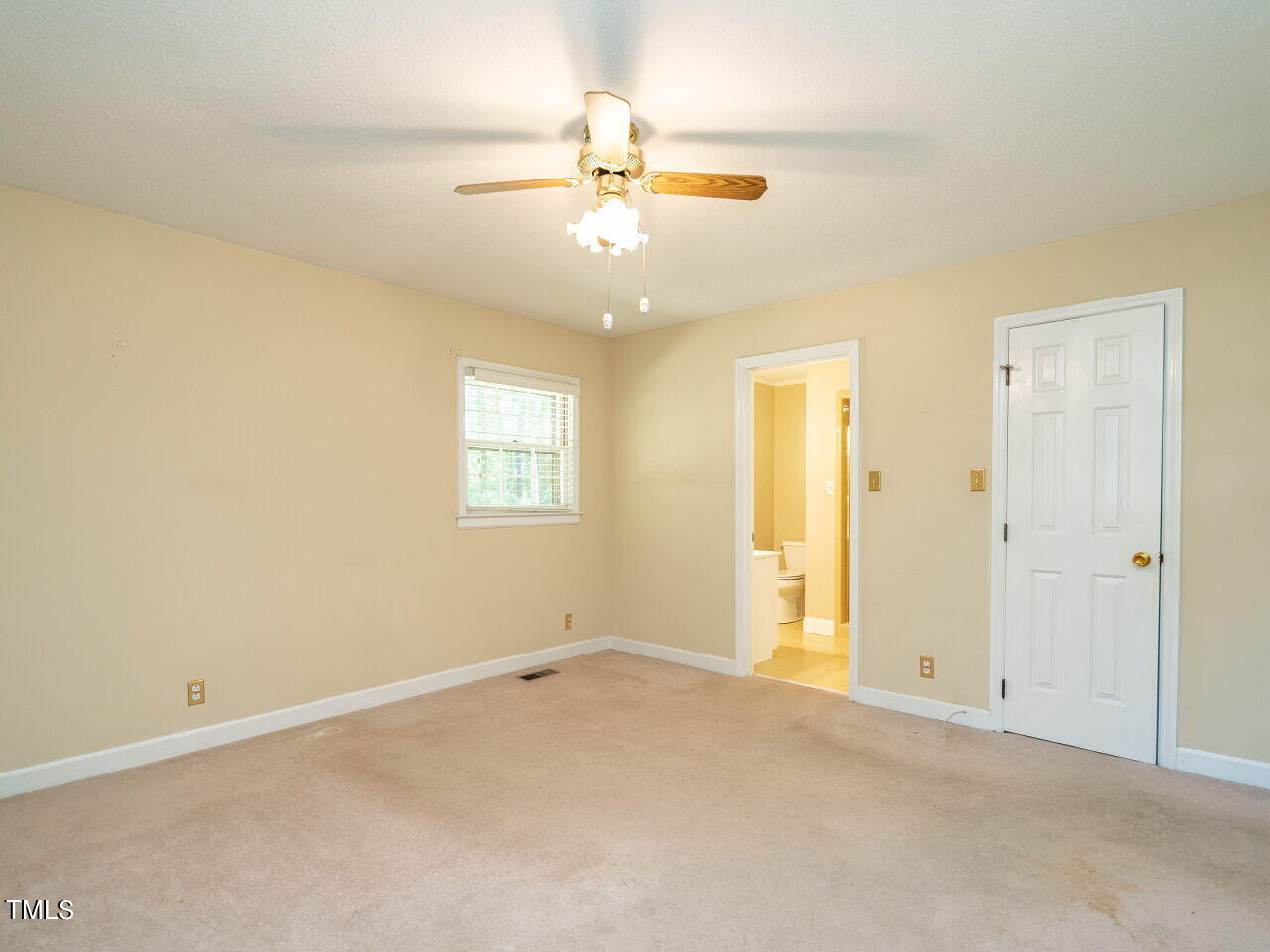 6600 Barbee Road Durham, NC 27713 - Photo 23 of 33 an empty room with a chandelier fan and windows