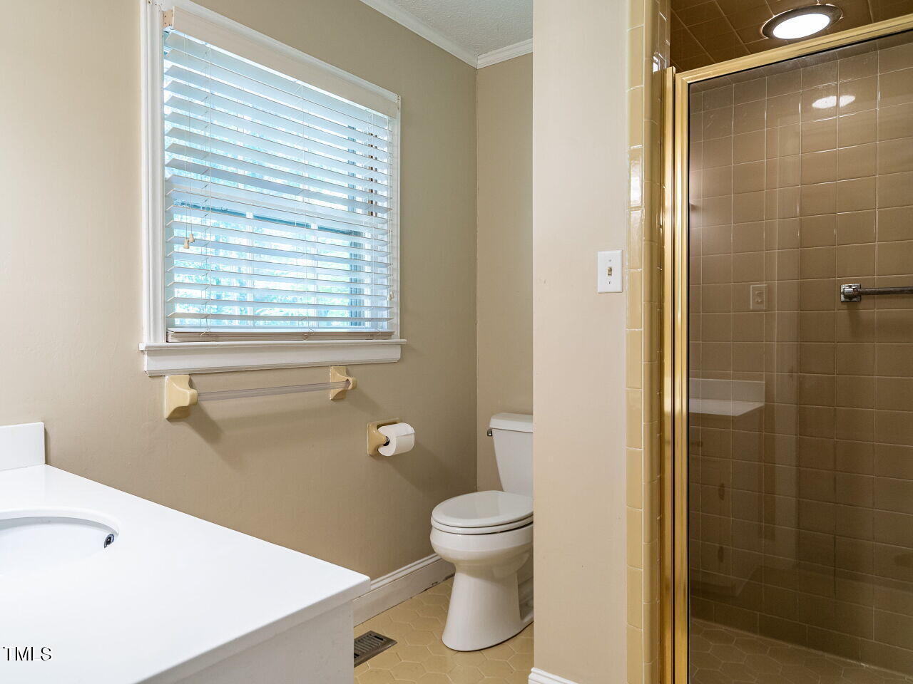 6600 Barbee Road Durham, NC 27713 - Photo 24 of 33 a bathroom with a toilet a sink and shower