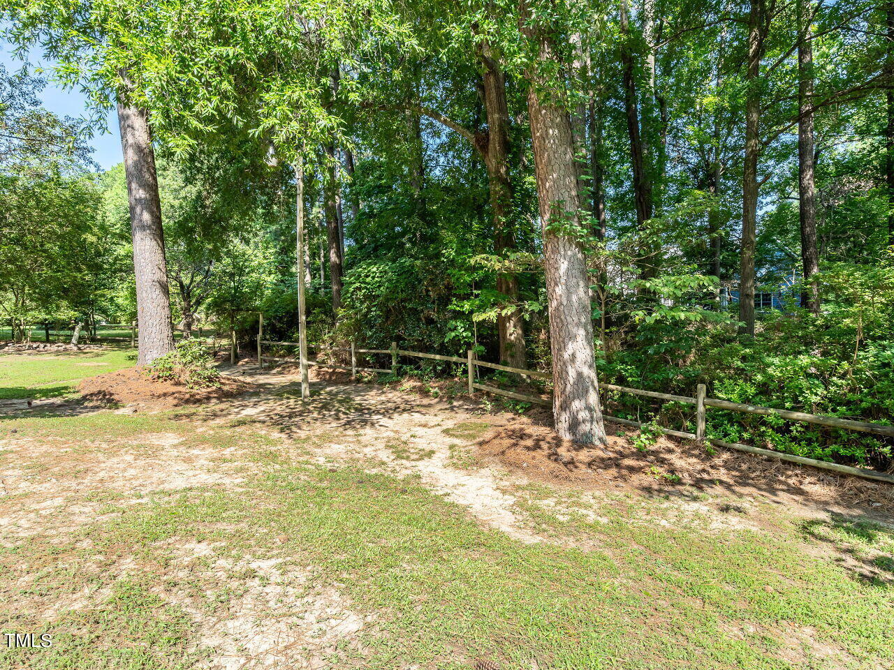 6600 Barbee Road Durham, NC 27713 - Photo 28 of 33 a backyard of a house with lots of green space and plants