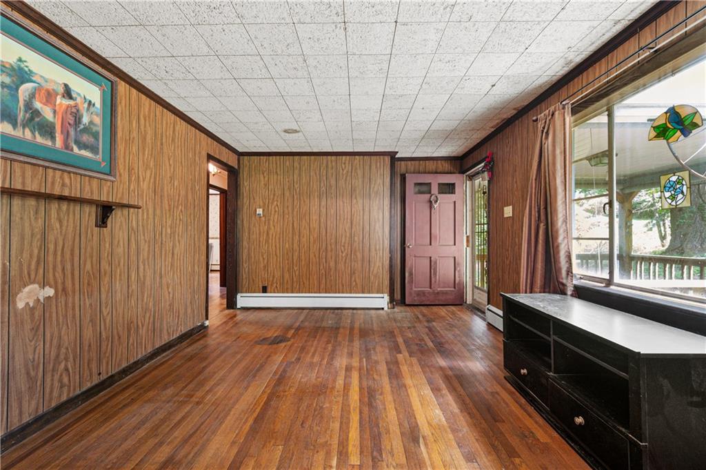 237 Leslie Road Valencia, PA 16059 - Photo 7 of 29 a view of hallway with wooden floor and stairs