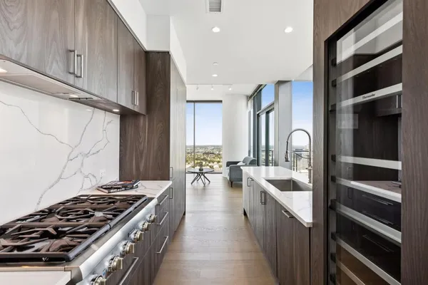 a kitchen with stove and cabinets