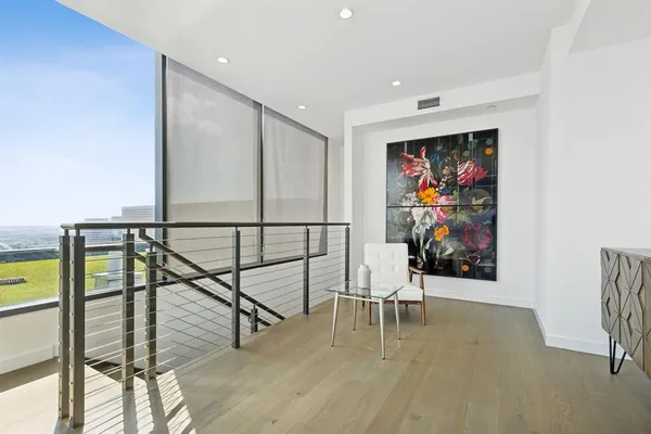 a bathroom with a double vanity sink and a toilet