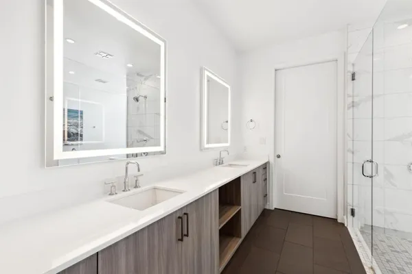a bathroom with a bathtub and shower