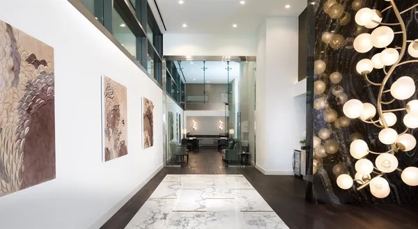 a entryway with furniture and wooden floor