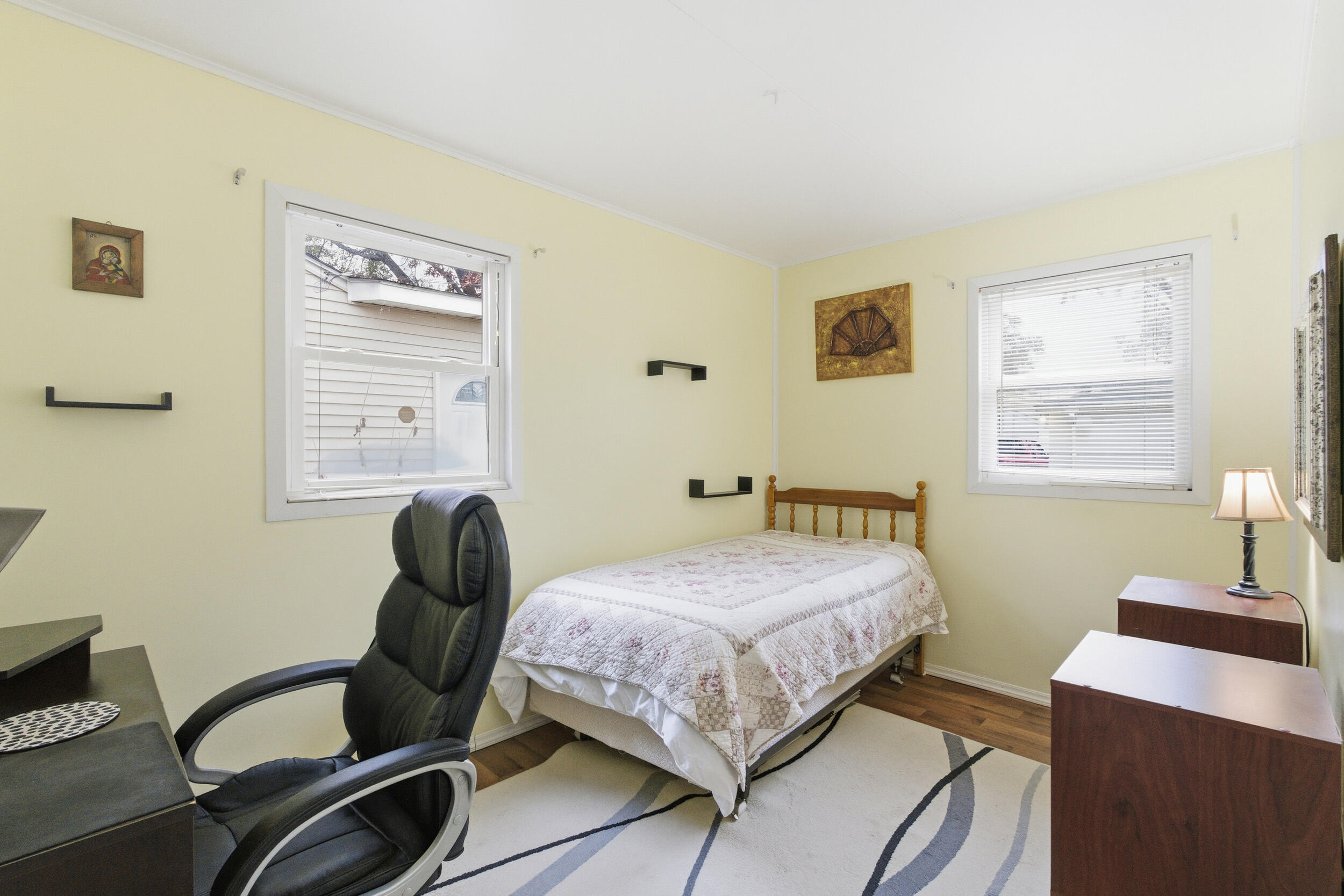 1678 174th Place Hammond, IN 46324 - Photo 13 of 18 a bedroom with a bed and a window