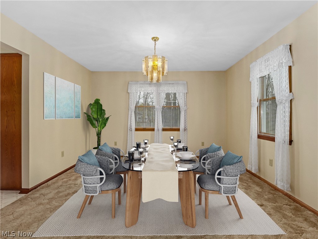 5175 Case Road North Ridgeville, OH 44039 - Photo 13 of 28 Dining room featuring a notable chandelier and light colored carpet