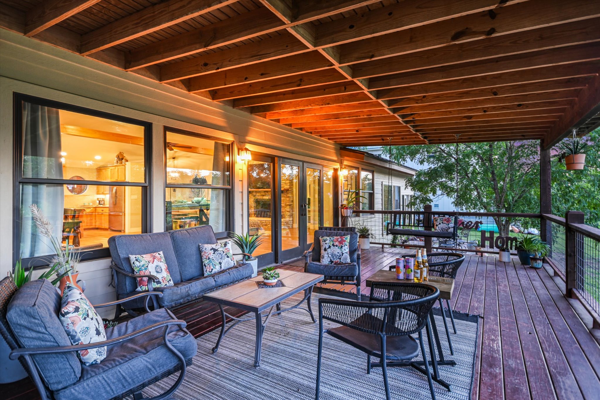 2411 Spoke Hollow Road Wimberley, TX 78676 - Photo 20 of 37 An inviting covered patio offers a comfortable outdoor living space with abundant natural light.