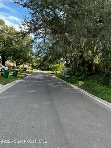 a view of a street with a trees