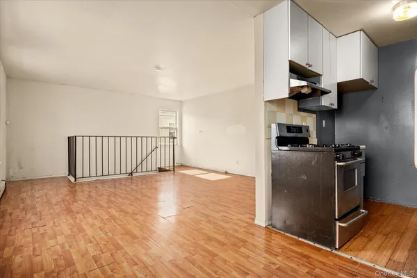 a view of a living room with wooden floor