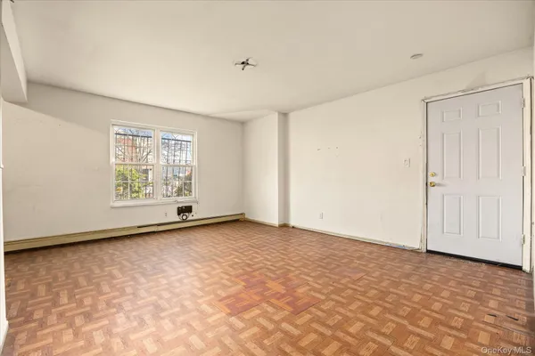 a view of an empty room with a window
