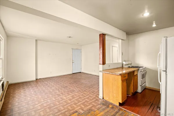 a view of a kitchen with a stove top oven
