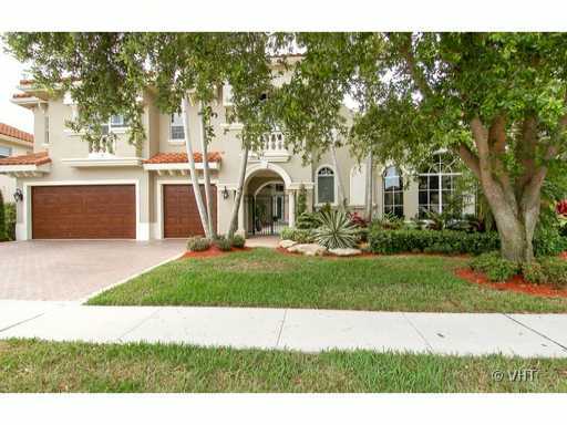 7096 Vía Marbella Boca Raton, FL 33433 - Photo 1 of 16 a front view of a house with a yard and a garage