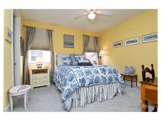 7096 Vía Marbella Boca Raton, FL 33433 - Photo 14 of 16 a bedroom with a bed and a couch