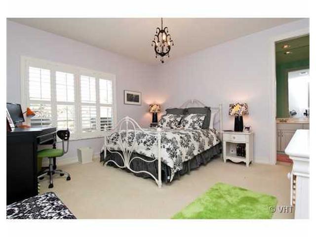 7096 Vía Marbella Boca Raton, FL 33433 - Photo 16 of 16 a bedroom with bed and a chandelier