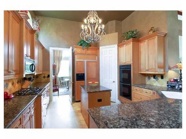 7096 Vía Marbella Boca Raton, FL 33433 - Photo 6 of 16 a kitchen with stainless steel appliances granite countertop a refrigerator a oven a sink and dishwasher