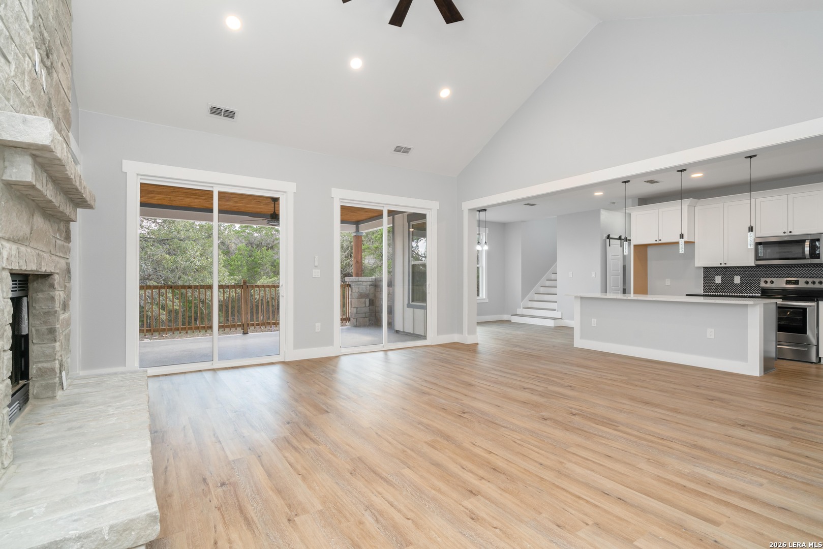 11608 Oak Country Helotes, TX 78023 - Photo 7 of 19 a view of an empty room with wooden floor and a window
