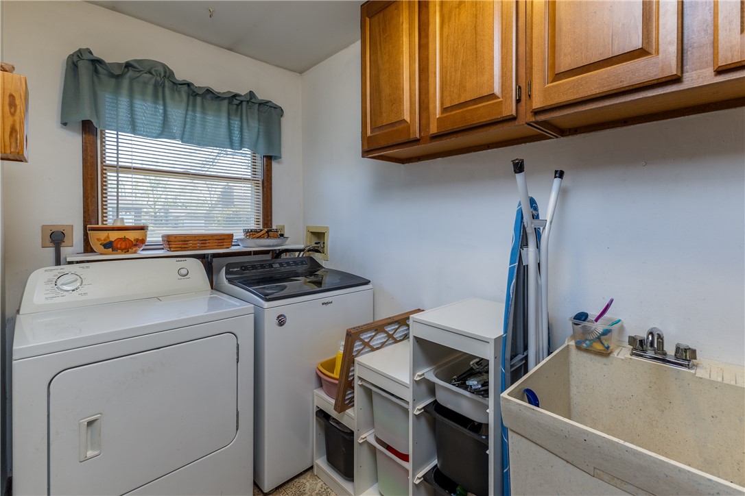 4210 Pleasanton Road Englewood, OH 45322 - Photo 27 of 34 This dedicated laundry space offers functionality and convenience for household chores.