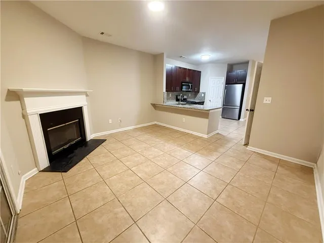 a kitchen with stainless steel appliances a stove a microwave and a refrigerator