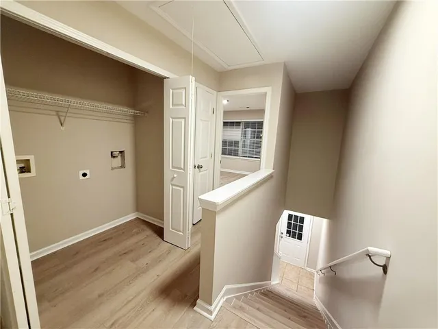 a view of a bedroom with wooden floor and bedroom