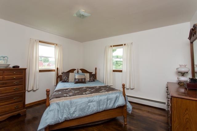 126 Cedar Ridge Road Waynesboro, VA 22980 - Photo 8 of 28 a bedroom with a bed and wooden floor