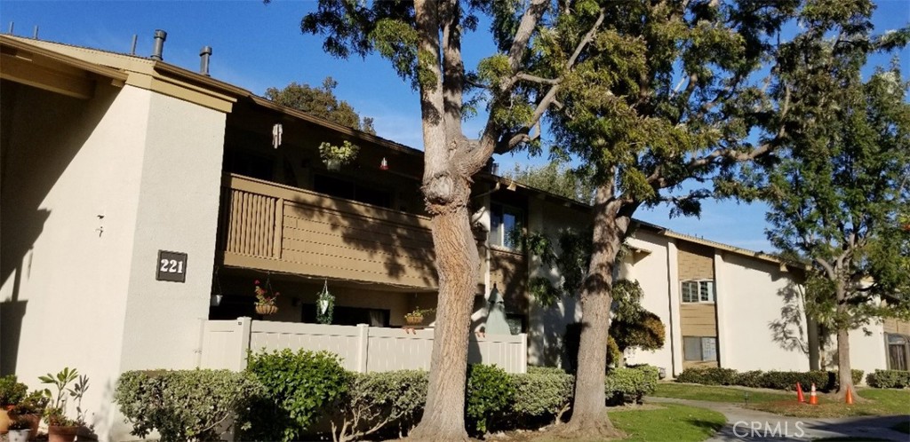a view of a house with a tree