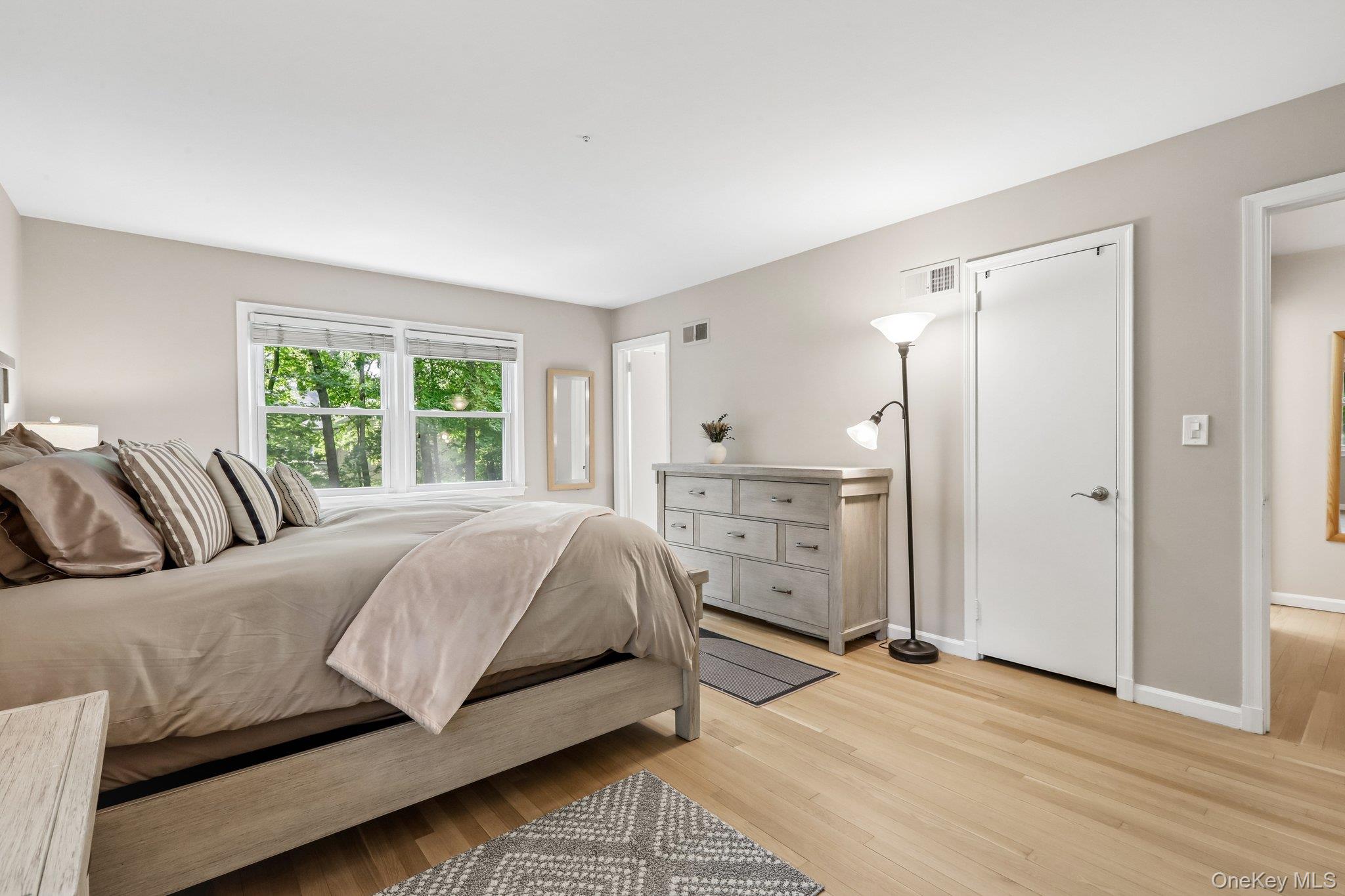62 Mohegan Road Larchmont, NY 10538 - Photo 31 of 46 a bedroom with a bed and a window