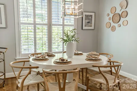 a view of a dining room and livingroom with furniture