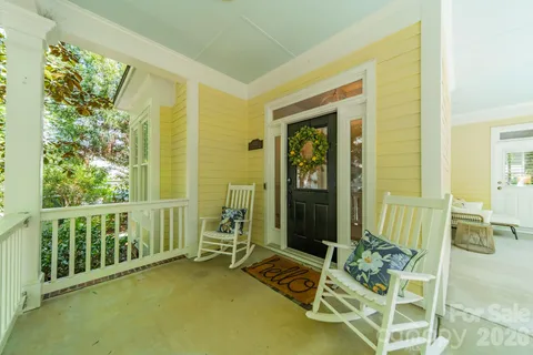 a view of an entryway with a table and chairs