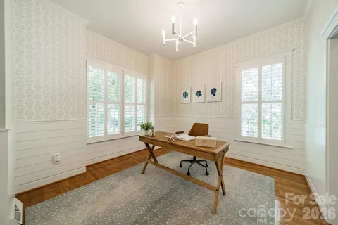 a work room with furniture and windows