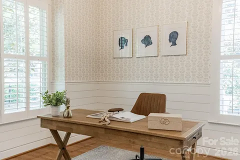 a workspace with furniture and window