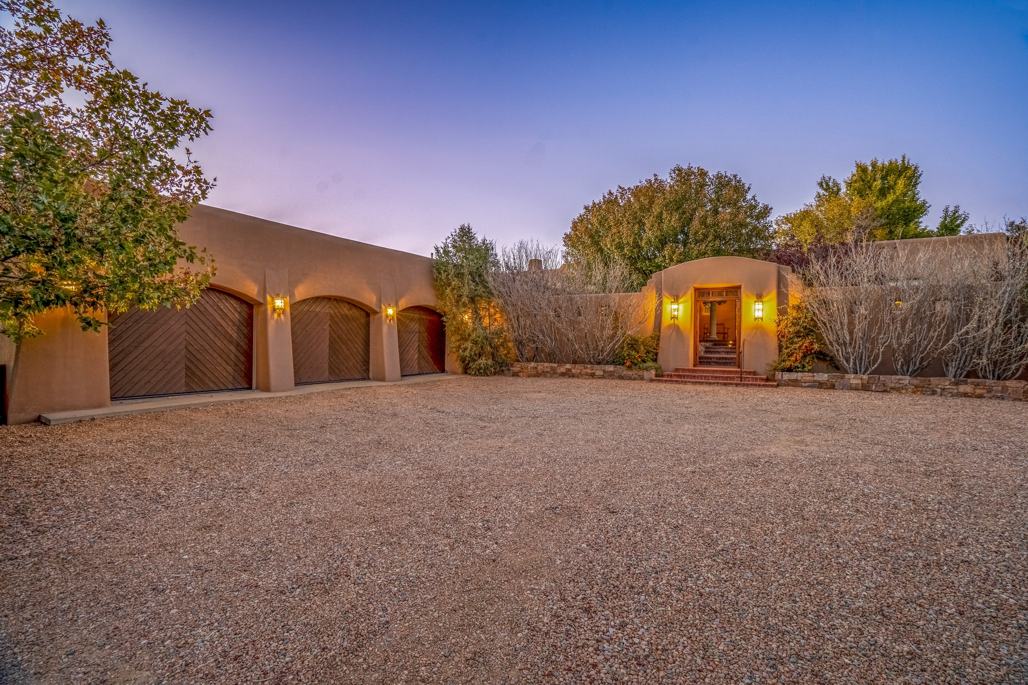 243 Double Arrow Road Santa Fe, NM 87505 - Photo 3 of 43 Three-car garage and front entryway