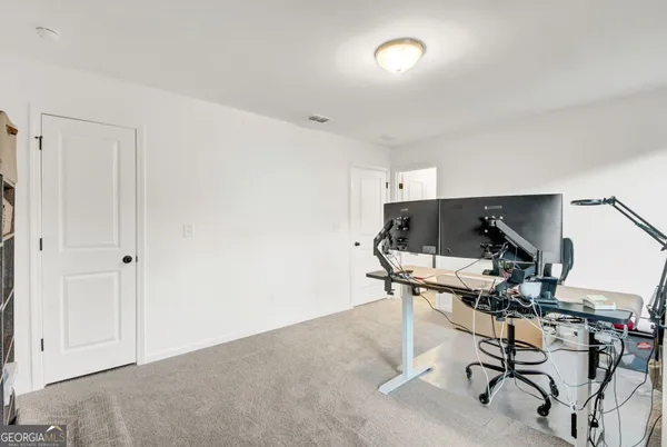 a view of workspace with wooden floor windows