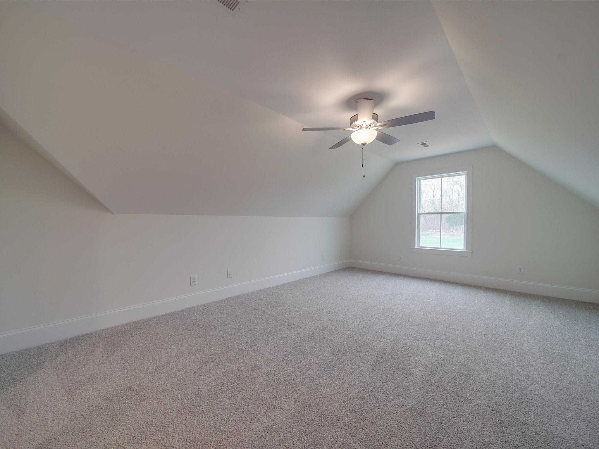 3815 East Brief Road Monroe, NC 28110 - Photo 26 of 46 a view of an empty room with a ceiling fan and window