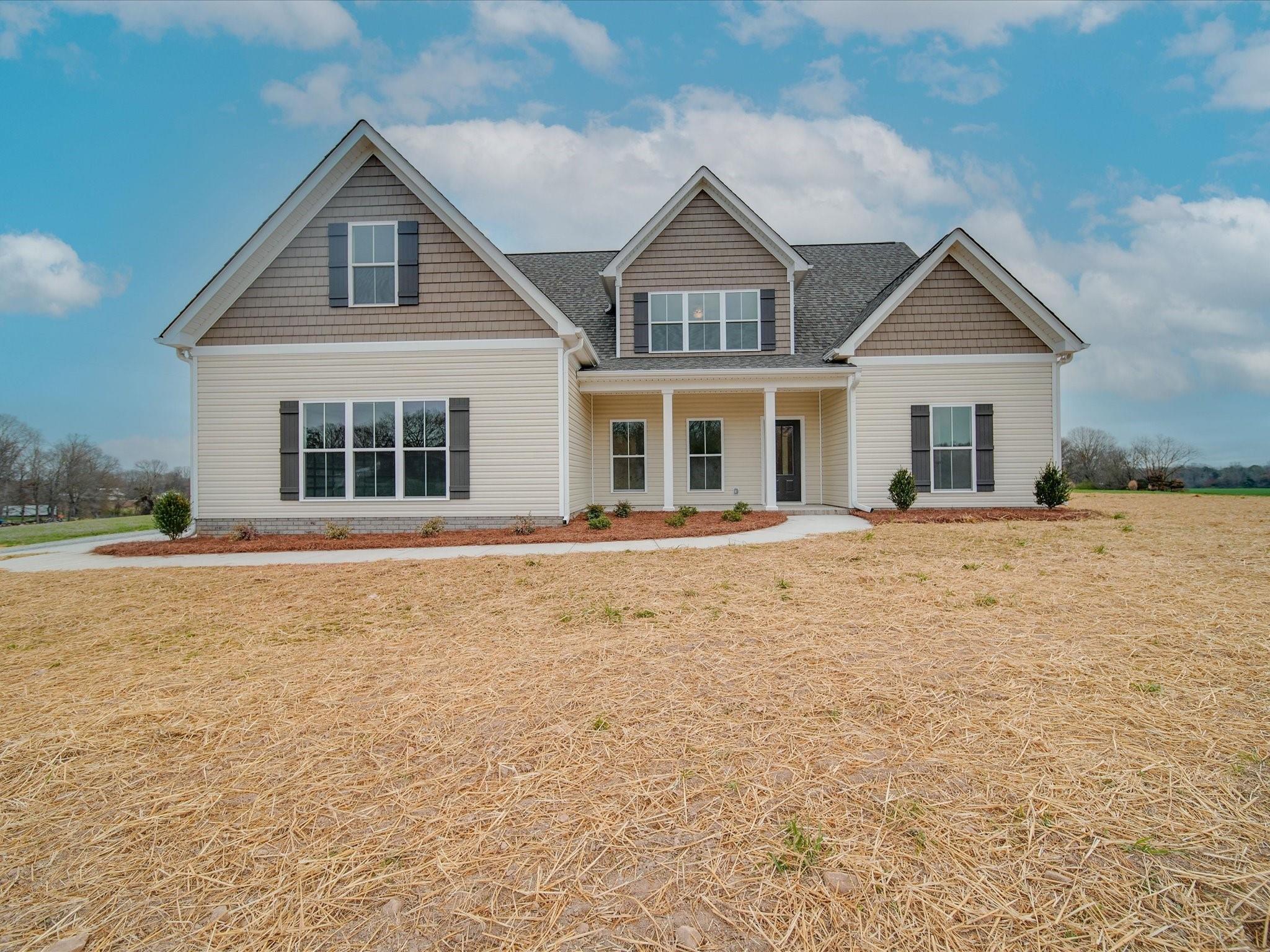 3815 East Brief Road Monroe, NC 28110 - Photo 6 of 46 a front view of a house with a yard