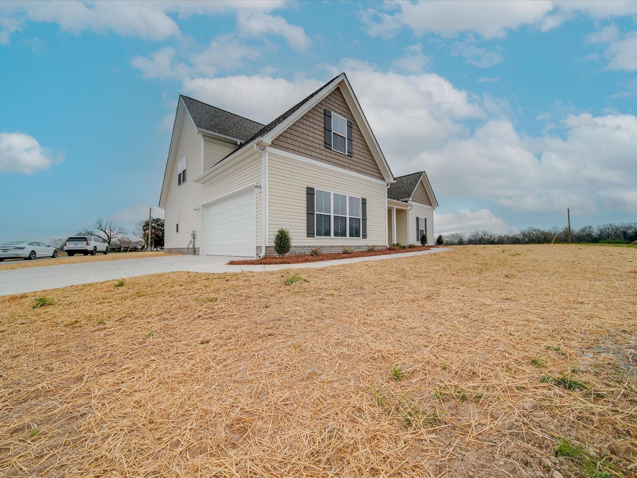 3815 East Brief Road Monroe, NC 28110 - Photo 7 of 46 a view of a house with a yard