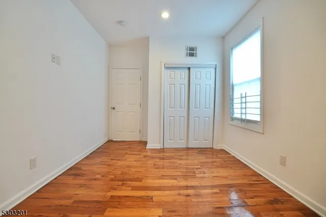 a white toilet sitting next to a bath tub and a shower