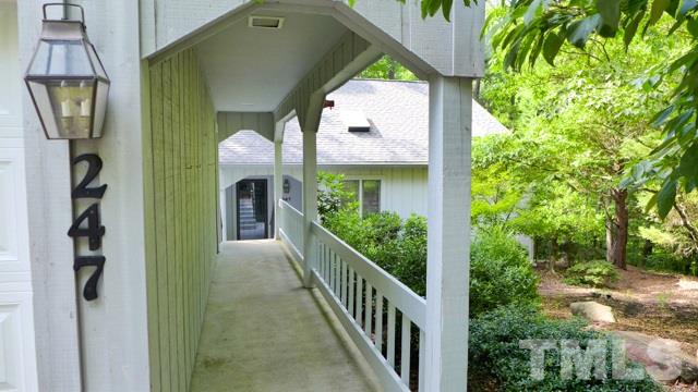 247 Fox Ridge Road Pittsboro, NC 27312 - Photo 2 of 24 The breezeway leading to your wonderful home. The garage is on your left; a back exterior door provides easy access to the house.