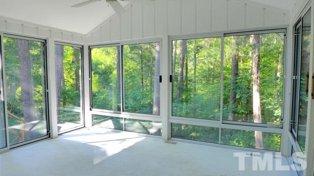 247 Fox Ridge Road Pittsboro, NC 27312 - Photo 11 of 24 You won’t want to leave the sunroom. Really! Windows on three sides soak in the lush surroundings. Woods, stream, and winter pond views are yours.