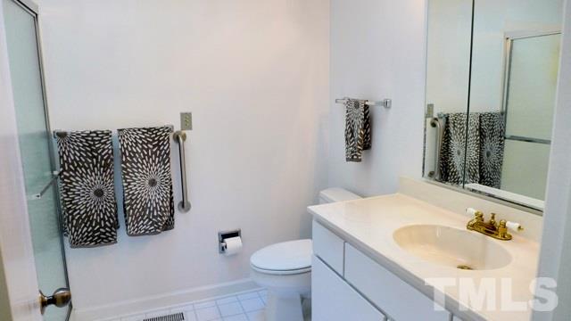 247 Fox Ridge Road Pittsboro, NC 27312 - Photo 14 of 24 The Master Bath offers vault ceiling with skylight and oversized walk-in shower.