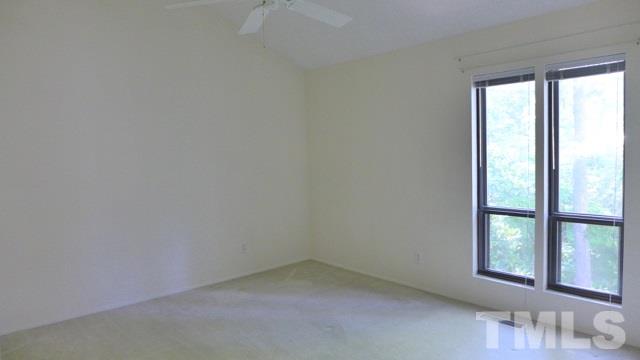 247 Fox Ridge Road Pittsboro, NC 27312 - Photo 16 of 24 Bedroom 3 overlooks the back, with dual windows framing the beautiful grounds.