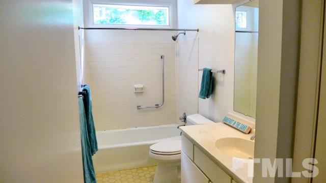 247 Fox Ridge Road Pittsboro, NC 27312 - Photo 17 of 24 The Hall bath features tub/shower combo with transom window above.