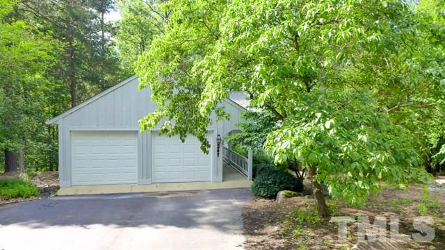 247 Fox Ridge Road Pittsboro, NC 27312 - Photo 21 of 24 Here, a view from the street. Spacious two car garage, with the house at back.