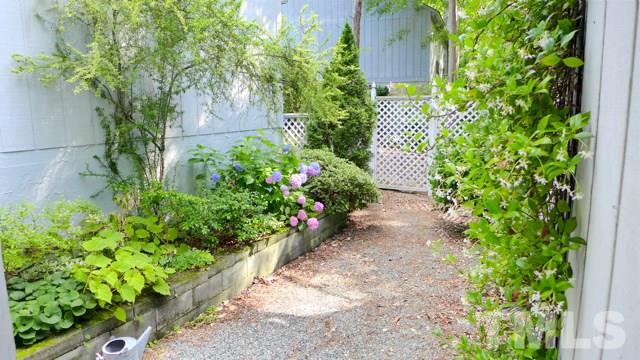 247 Fox Ridge Road Pittsboro, NC 27312 - Photo 4 of 24 There's a charming front courtyard, too, with fragrant plantings.