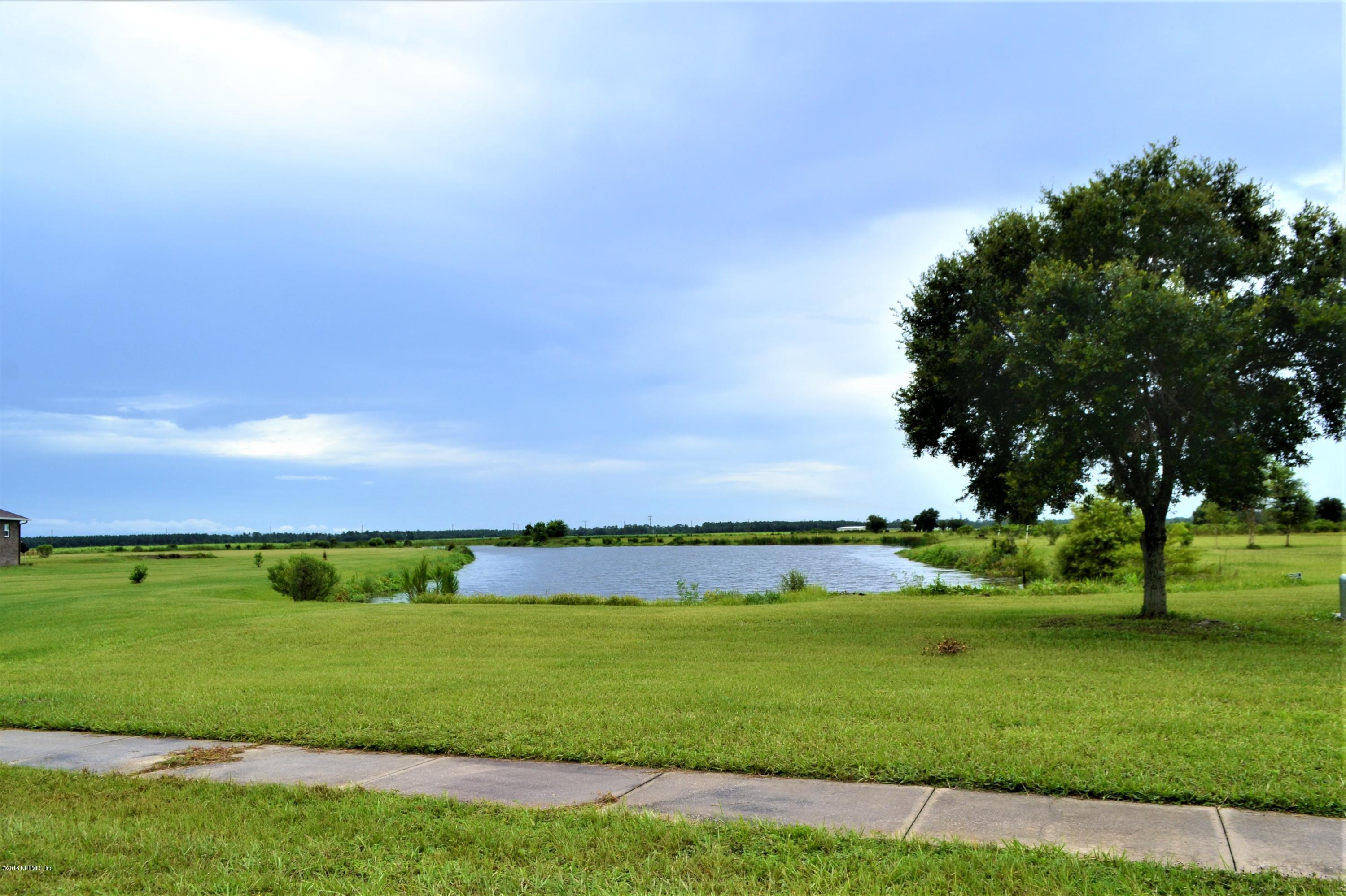212 Pleasant Colony Road Elkton, FL 32033 - Photo 4 of 7 Pond in neighborhood