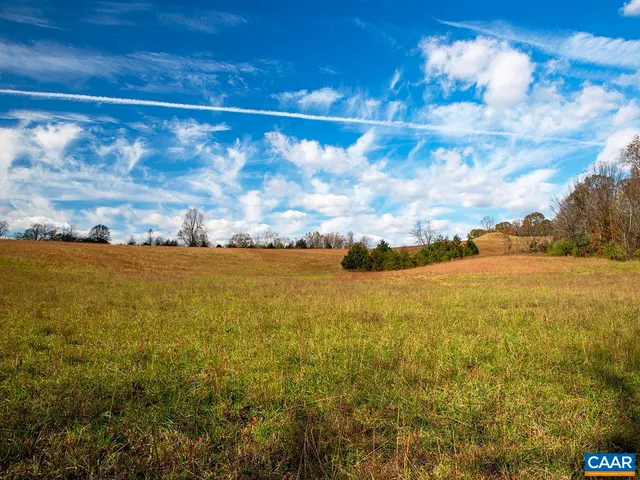 a view of an ocean and a yard