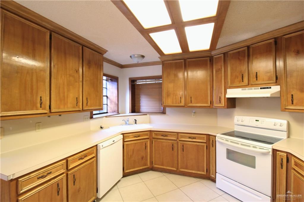 2125 Sabinal Street Mission, TX 78572 - Photo 4 of 12 a kitchen with a sink cabinets and window