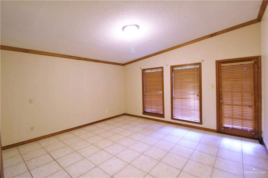 2125 Sabinal Street Mission, TX 78572 - Photo 5 of 12 an empty room with windows