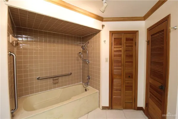 a bathroom with a bathtub and a shower