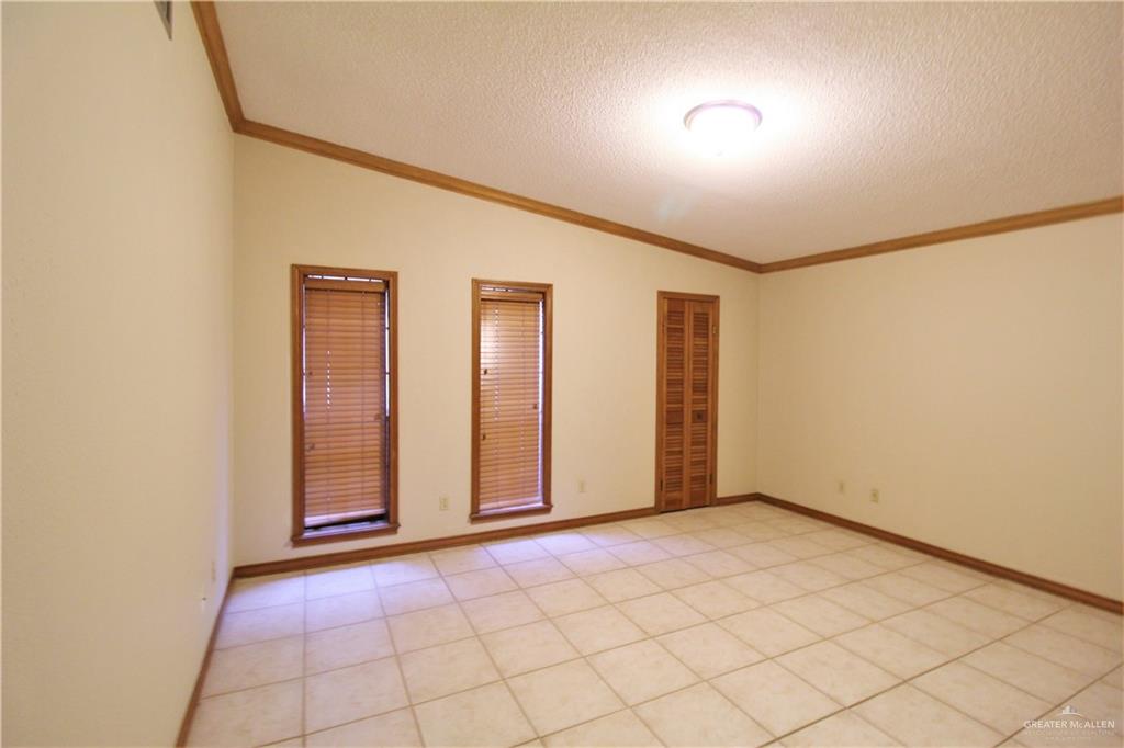 2125 Sabinal Street Mission, TX 78572 - Photo 9 of 12 an empty room with windows
